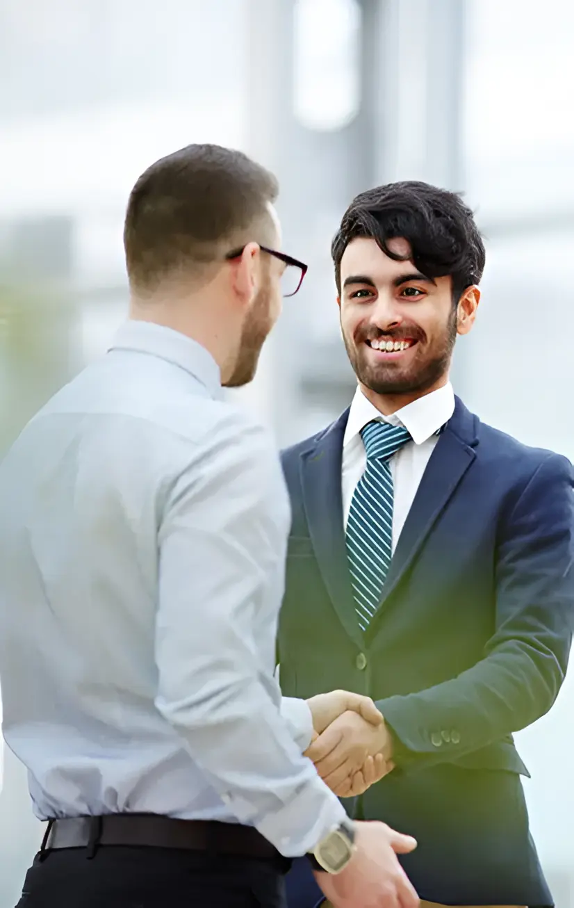 Business professionals shaking hands